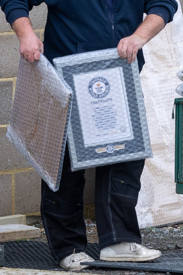 Workers removed Sir Tom's Guinness World Record certificate and his BBC sporting award