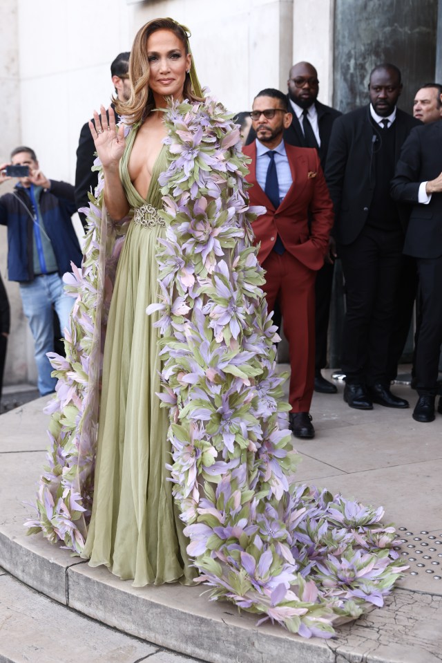 The singer showed off her floral gown as she waved to fans