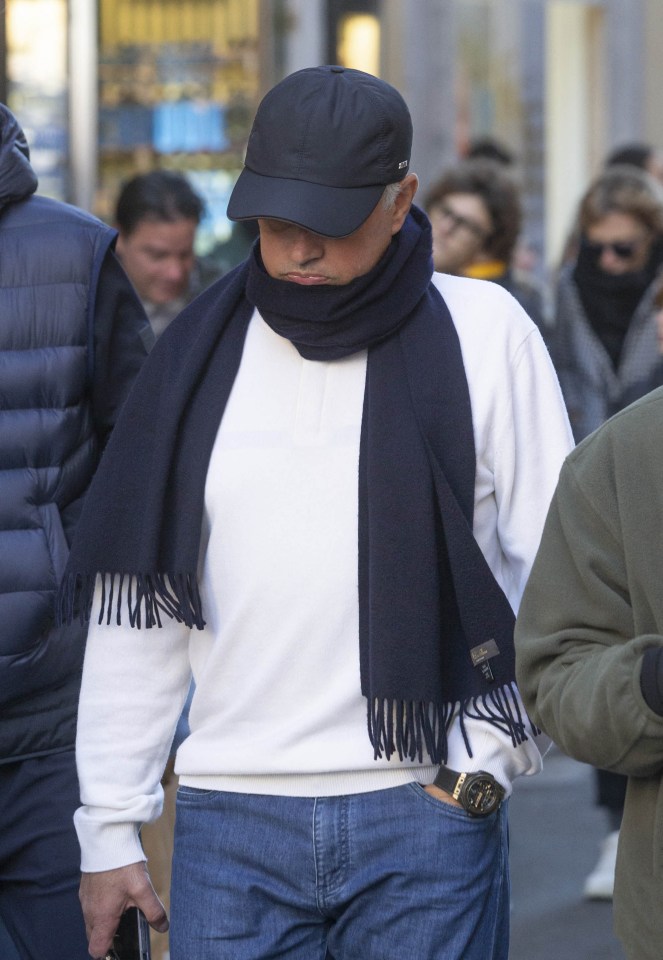 Jose Mourinho wore a cap and scarf as he headed out