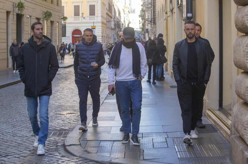 The group walked through the streets of Rome