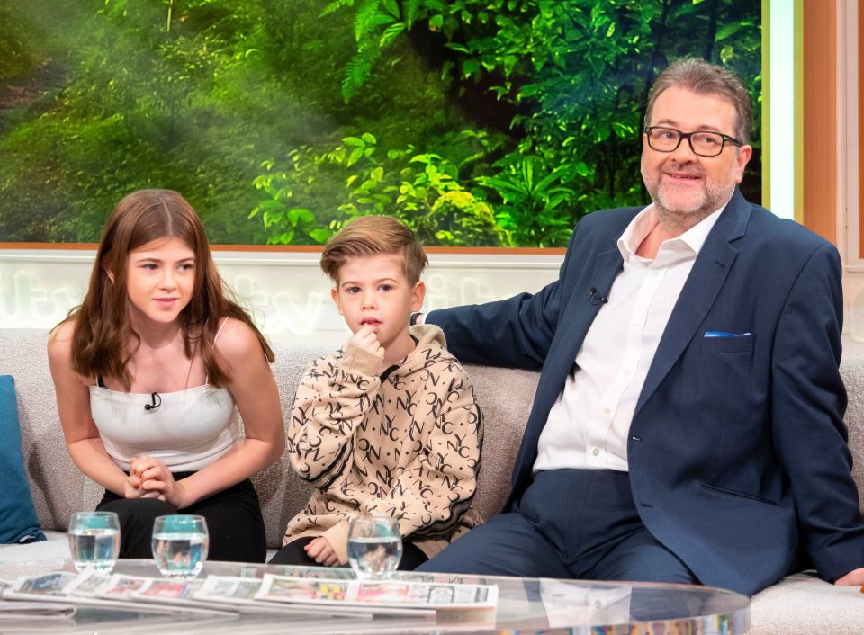 Derek with children Darcey Mary Draper and William Garraway Draper on GMTV