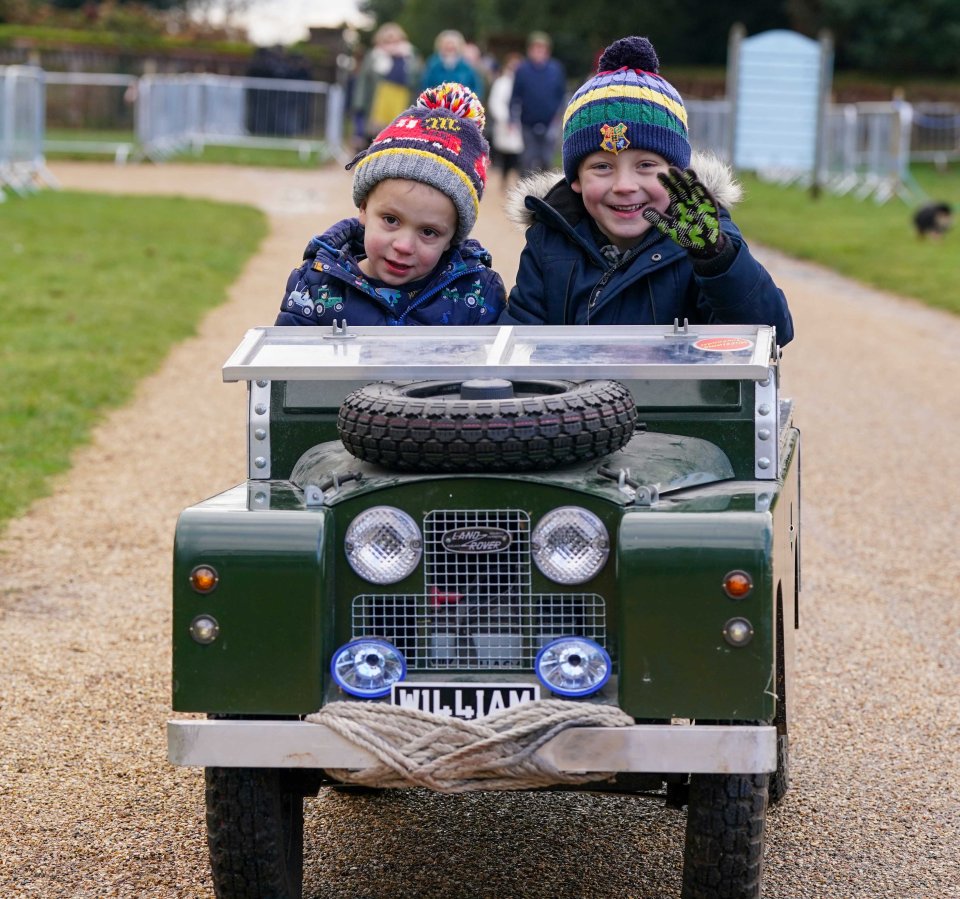 William (right) aged 6 and brother Oliver (left), 3, sit in their homemade Land Rover