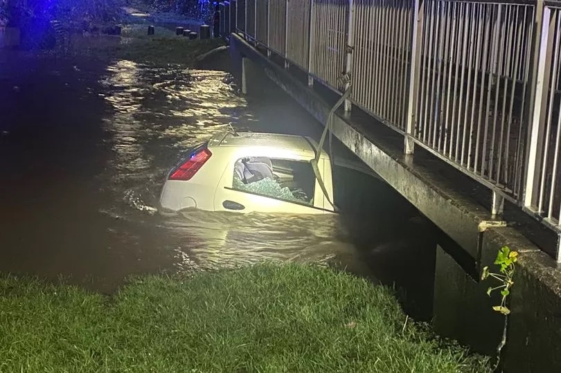 A hero saved a three-year-old child from a submerged car in Birmingham