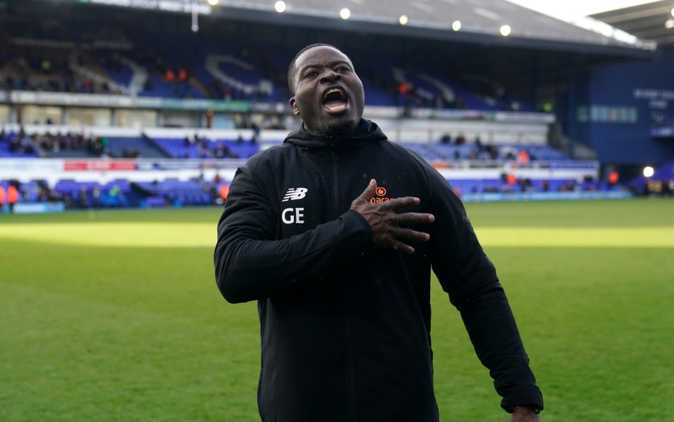 Maidstone manager George Elokobi celebrates in front of the fans