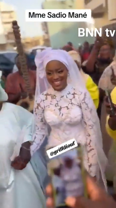 Bride Aisha Tamba was seen beaming with joy as she made her way to her wedding