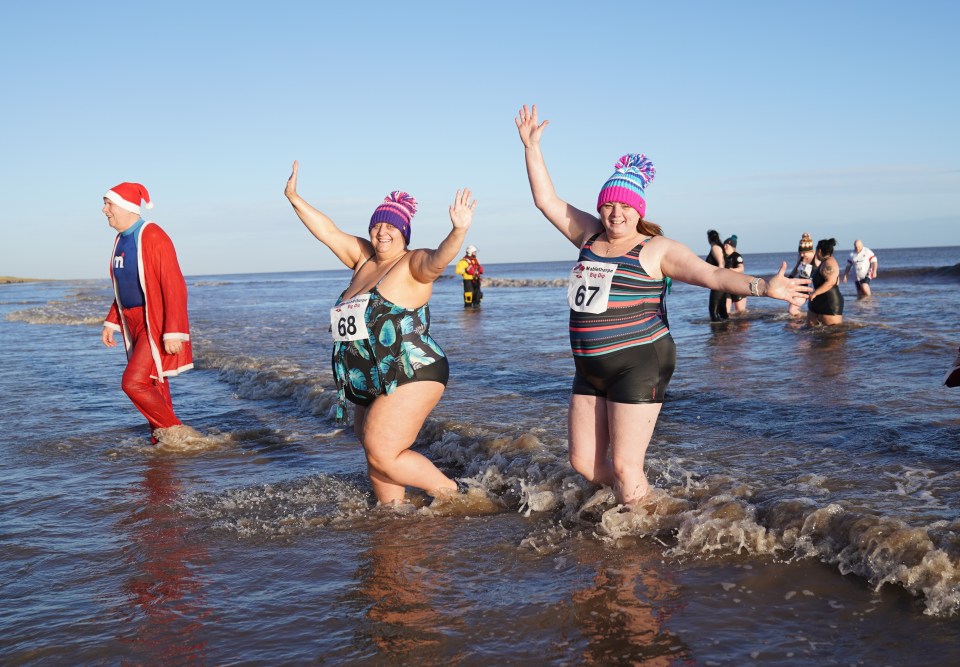 Another reveller hit the water dressed as Father Christmas