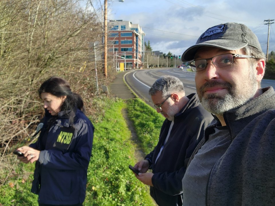 Seanathan Bates (pictured right) showing investigators where he discovered the phone on the side of the road