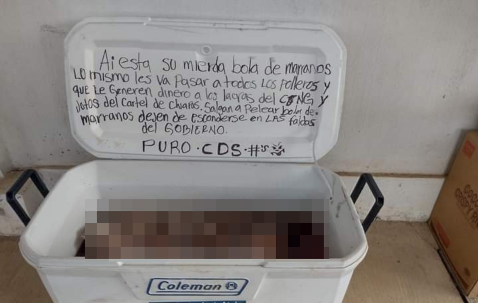 The cooler with human heads was left in a gas station with a threatening note attached to the lid