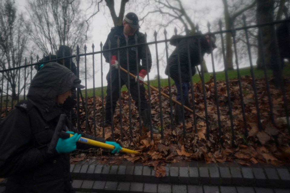 Police officers conduct a search on Primrose Hill