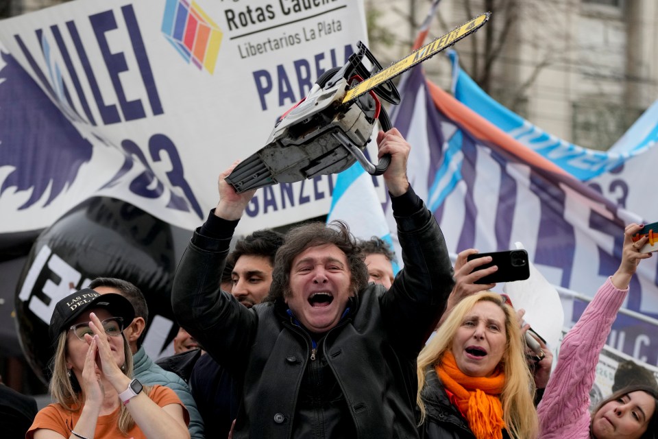 Presidential hopeful Javier Mile brandishes a chainsaw during a campaign rally