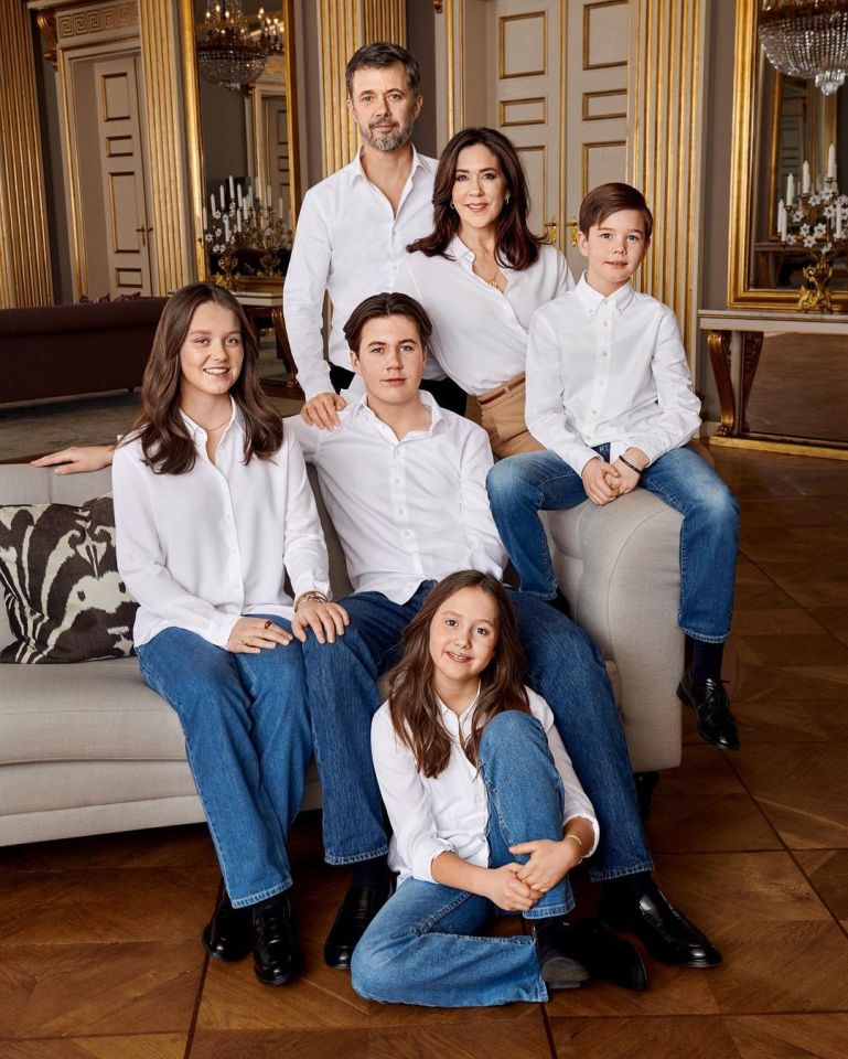 Frederik and Mary with their children in matching white shirts and blue jeans