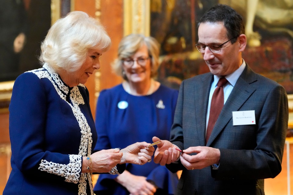 A day later Camilla was all smiles during a Windsor Castle reception