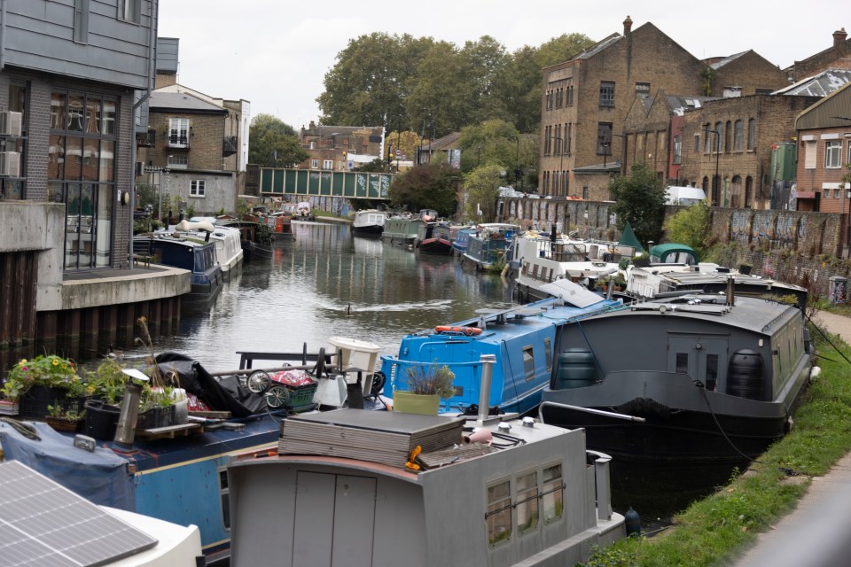 Boats line the Regent's canal were hundreds of homeowners live