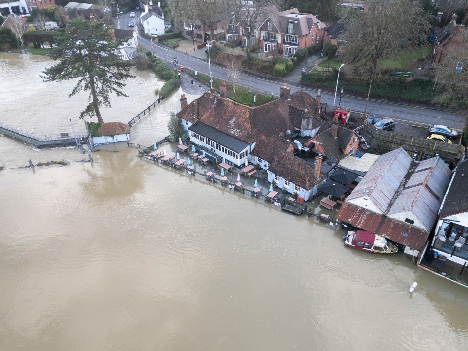 Floodwaters were rising in Pangbourne, Berks yesterday