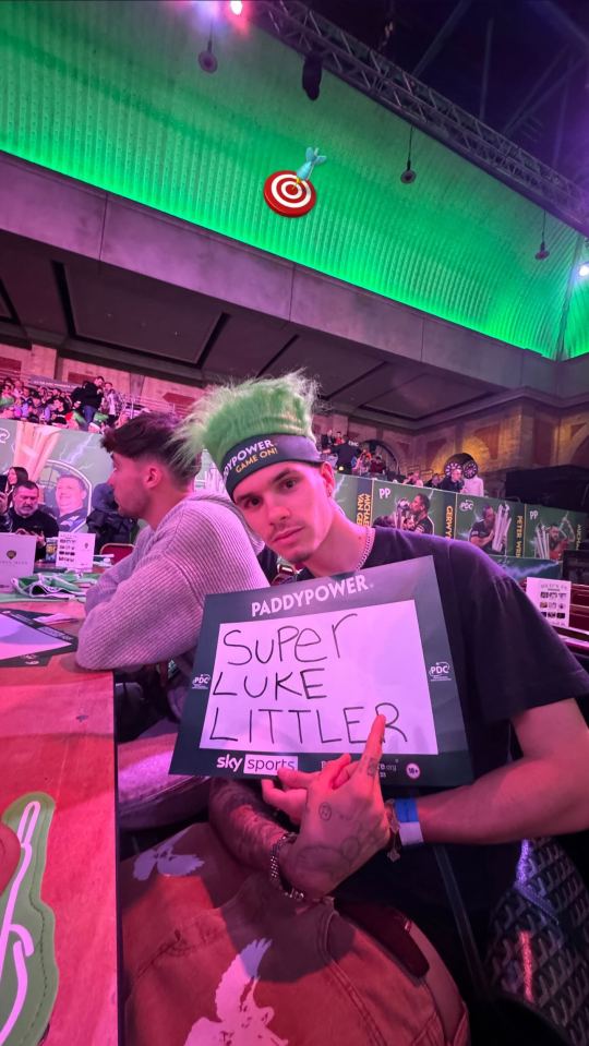 Romeo showed his support for Littler with a sign in the crowd