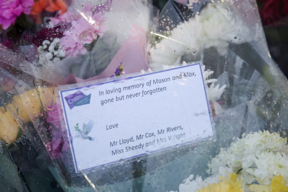 Floral tributes are left near the spot where two teens were stabbed