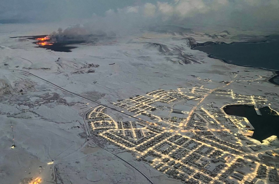 The evacuated Icelandic town of Grindavik last month as smoke billowed and lava was thrown into the air from a fissure during a volcanic eruption