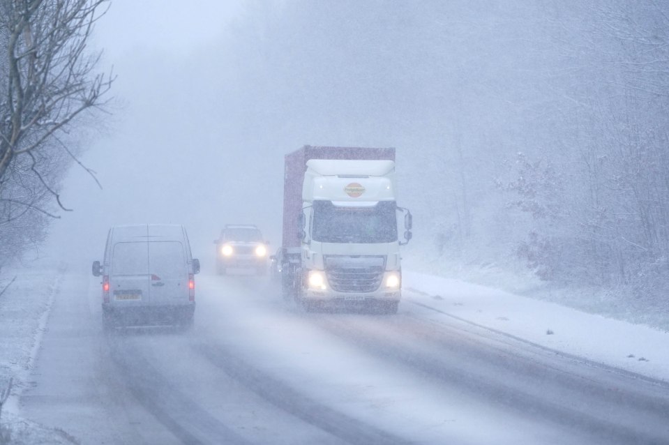 Drivers have a tough time on the snow covered roads in Keswick in Cumbria