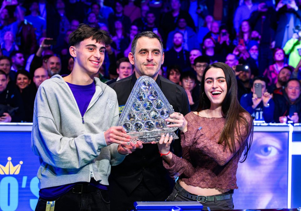 Ronnie celebrates his Grand Prix win with children Ronnie Jr and Lily