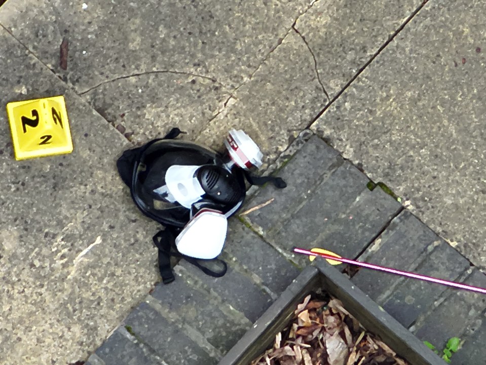 Crossbow bolts and a gas mask were among items strewn across the pavement