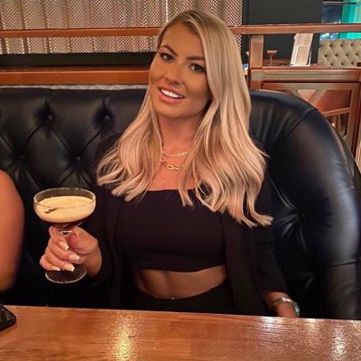 Jennifer sipping an espresso martini in a posh-looking bar