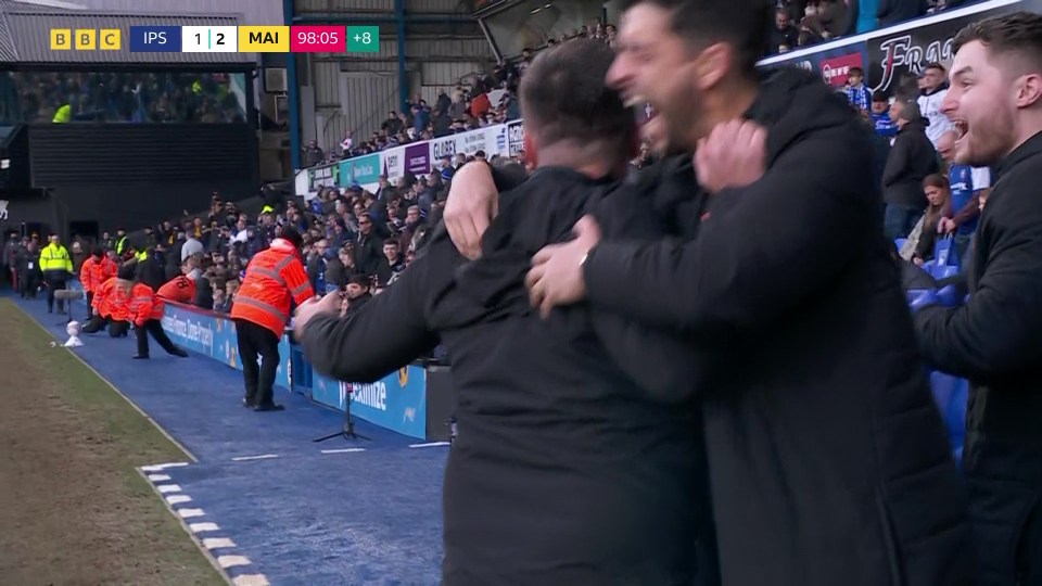 The Maidstone bench scream with delight at the final whistle