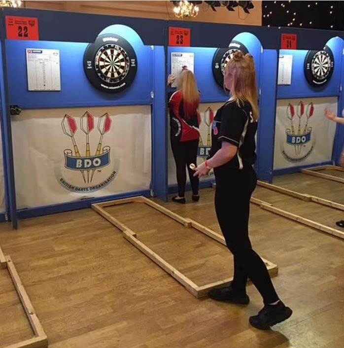 Eloise plays darts and is part of the Surrey Women's team