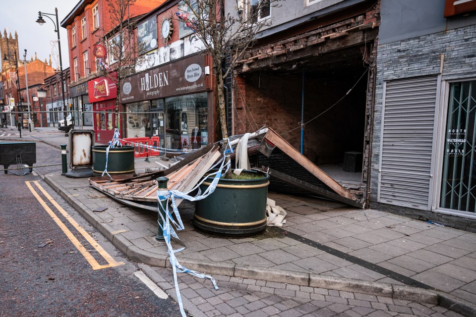 The front of a building collapsed onto the street in Oldham