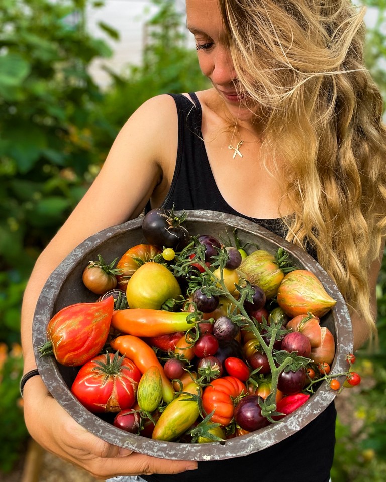 Founder Lucy Hutchings from She Grows Veg with the veg she's grown from seed