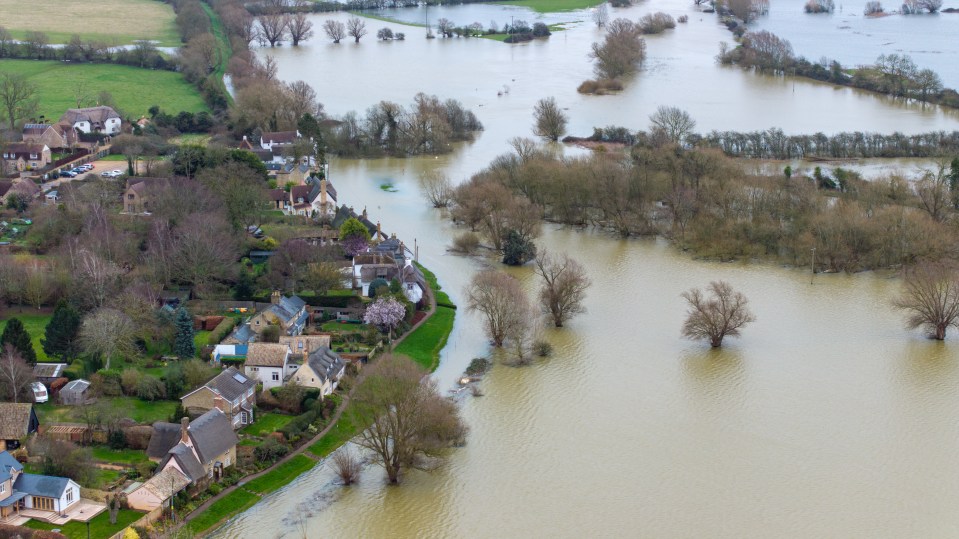 Flooding on the High Street and fields in Holywell in Cambridgeshire on Tuesday morning after the River Great Ouse burst its banks