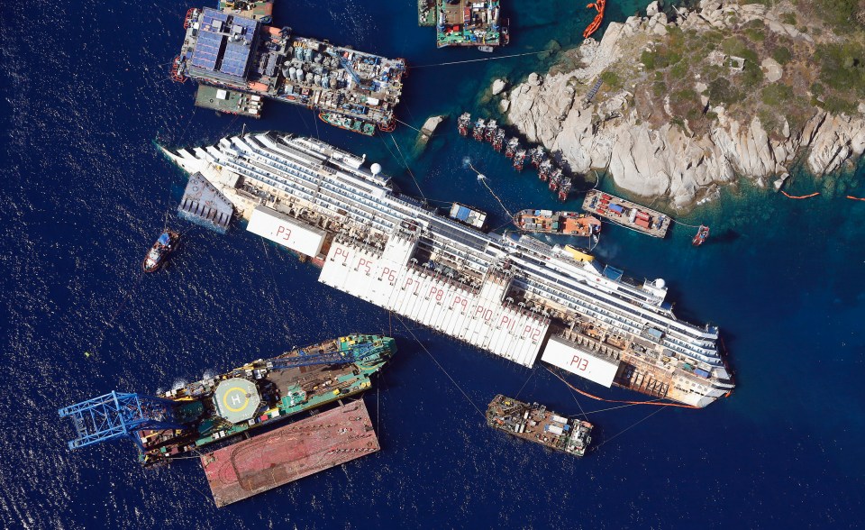 Aerial view showing Concordia as it lies on its side next to Giglio Island