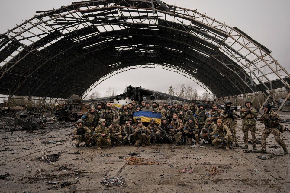 Ukrainian servicemen photographed in Hostomel on April 2, 2022 after expelling Russian troops