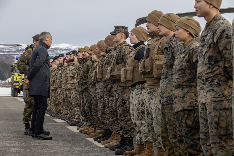 Nato Secretary General Jens Stoltenberg speaks with US Marines during Exercise Cold Response 2022