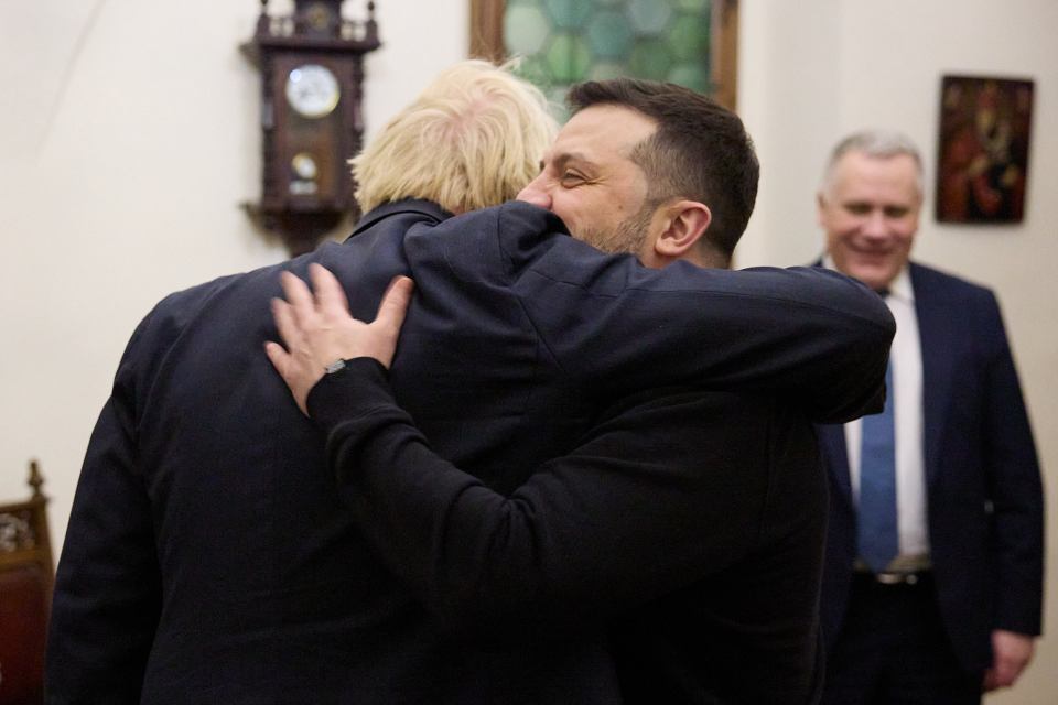 Boris Johnson embraced Ukrainian President Volodomyr Zelensky as he made a surprise visit to Ukraine on the second anniversary of the Russian invasion