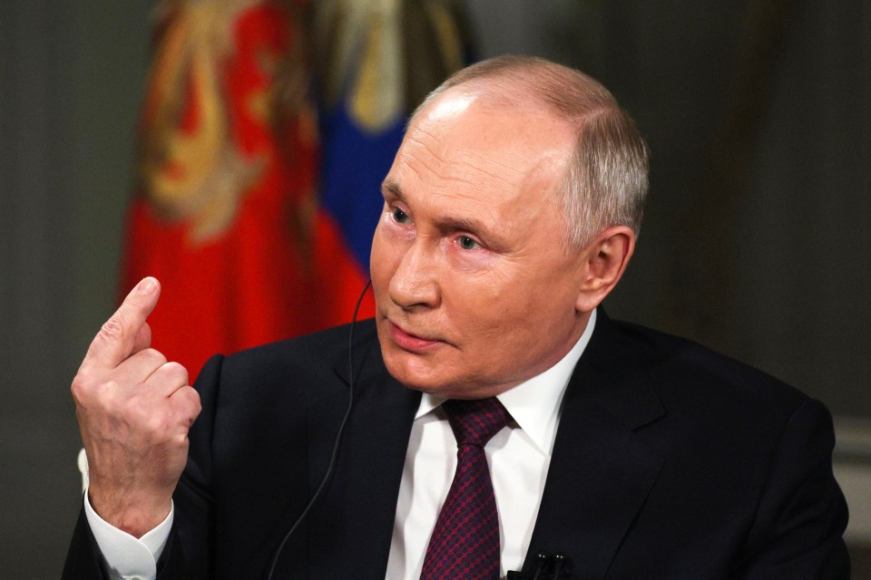 Vladimir Putin gestures while speaking during an interview with Tucker Carlson in Moscow on February 6