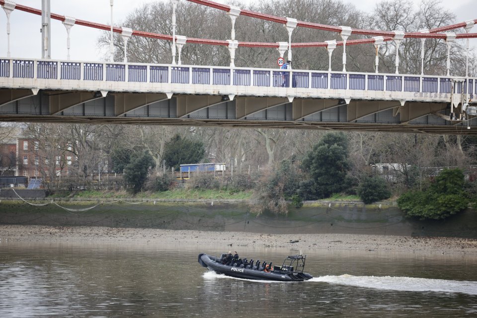 A Police boat is seen as officers search the Thames for the body of Clapham acid attack suspect Abdul Ezedi