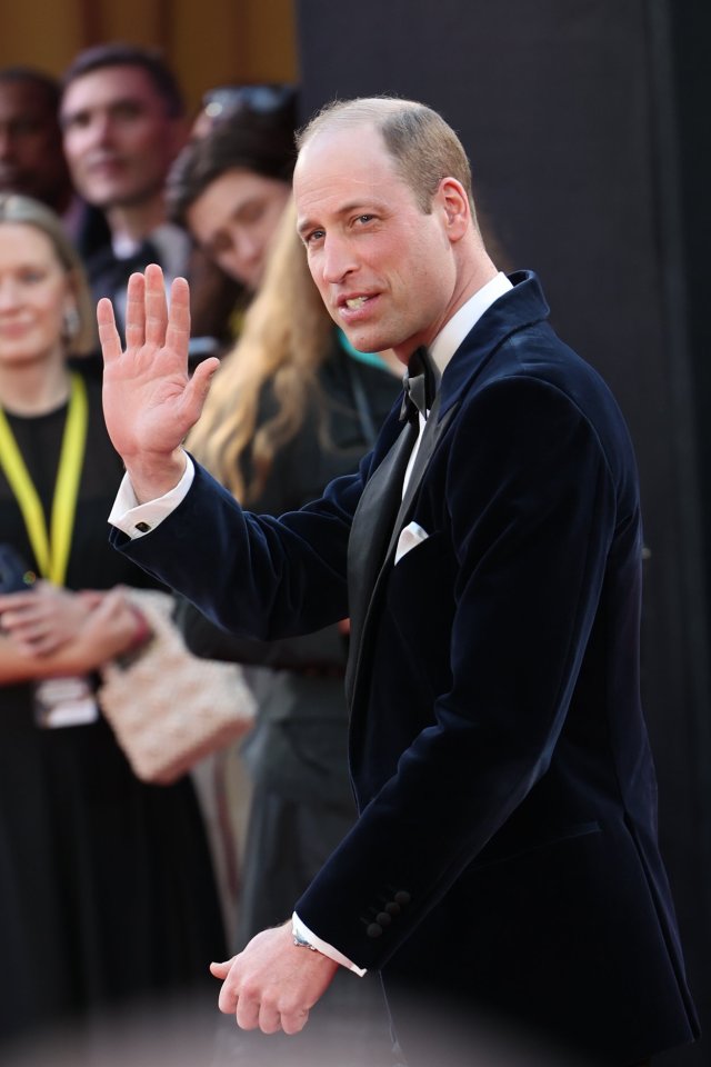 Wills waved to fans waiting along the red carpet