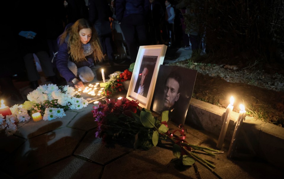 A woman lights a candle in Sofia, Bulgaria