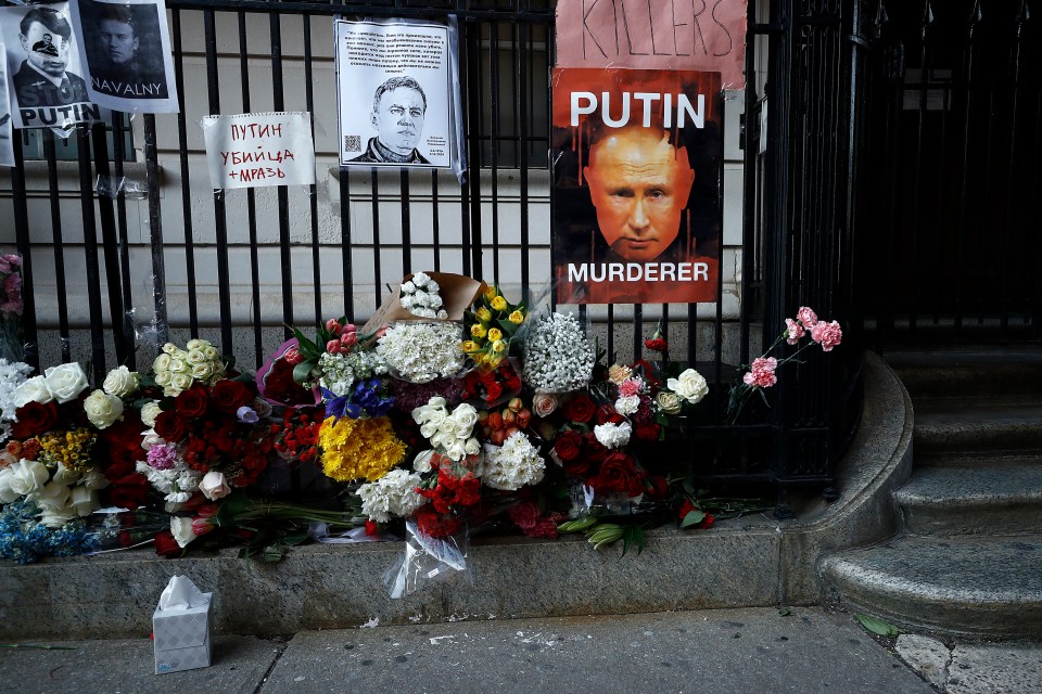 Flowers and signs are placed outside the Russian Consulate for Navalny