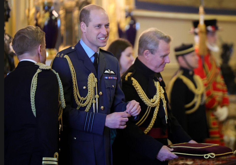 The Prince of Wales prepares to perform an investiture ceremony at Windsor Castle