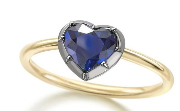 Meghan wears a Jessica McCormack ring that is 'set with a 0.94 carat heart cut sapphire'