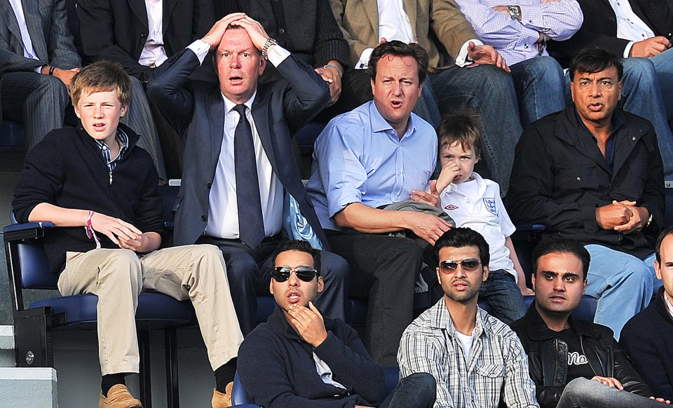 Pramod's brother, Lakshmi, was part of Britain's upper class and is pictured right of former British Prime Minister David Cameron