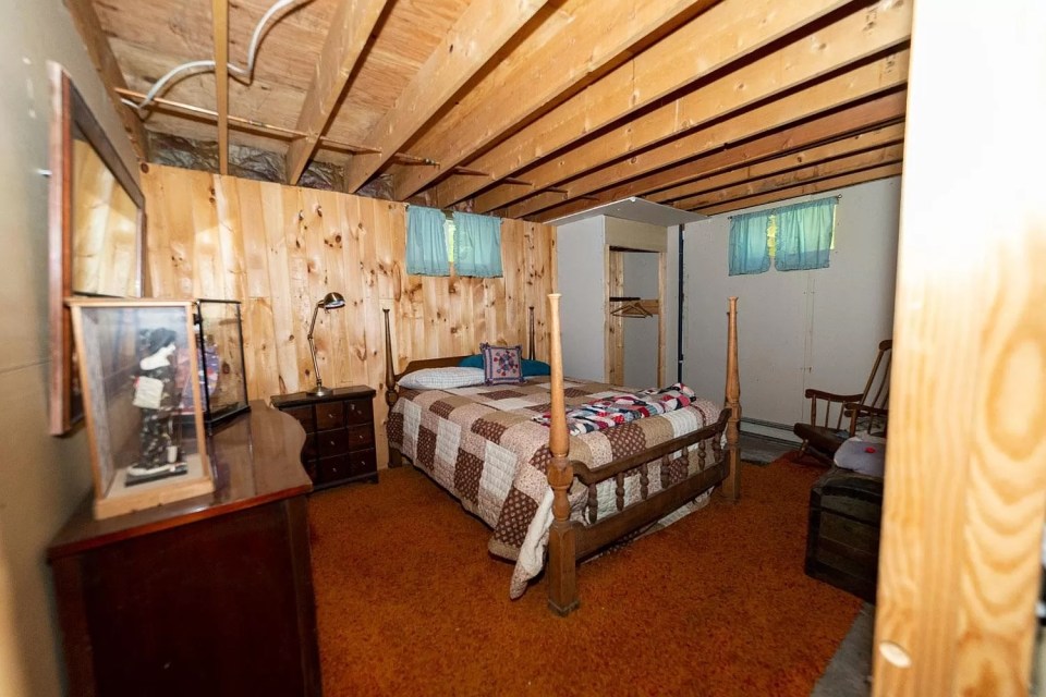 The master bedroom is somewhat small, with enough room for a small two-person bed