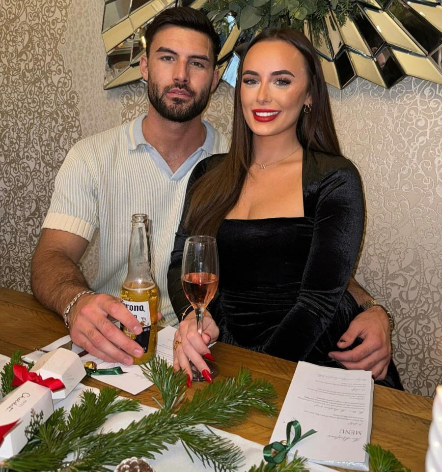 Millie and Liam share a festive meal and a happy embrace