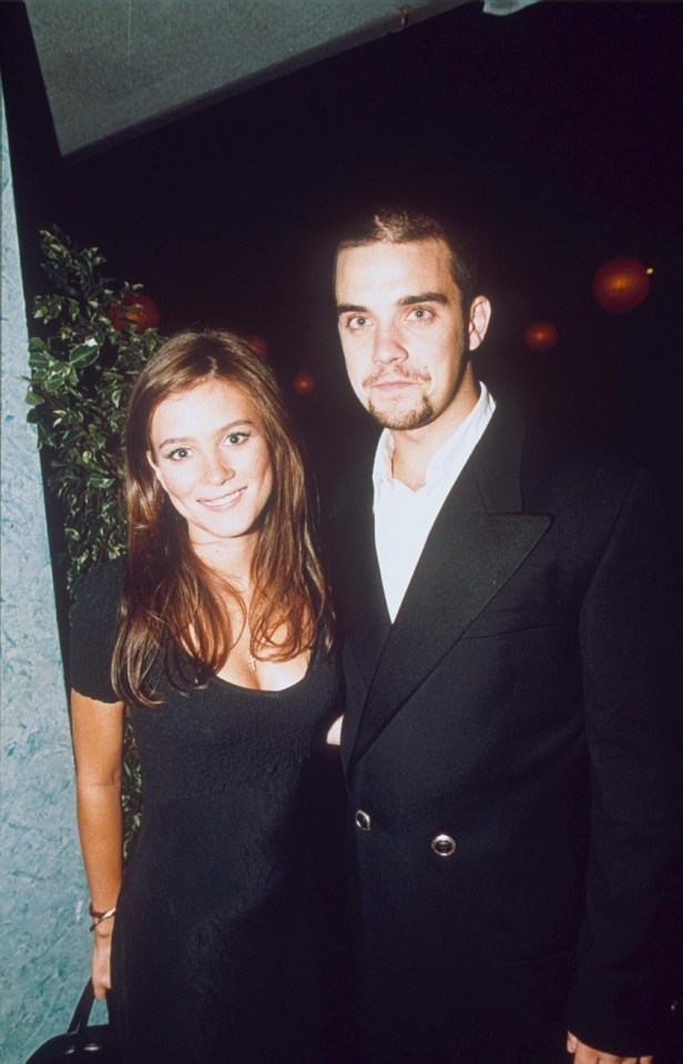 Robbie with Anna Friel in 1995