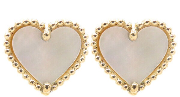 The earrings are a replica of the Van Cleef's pair worth over £2,100 (pictured above)