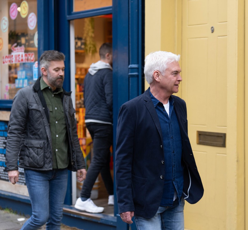 He was photographed going for a walk in Central London dressed in blue