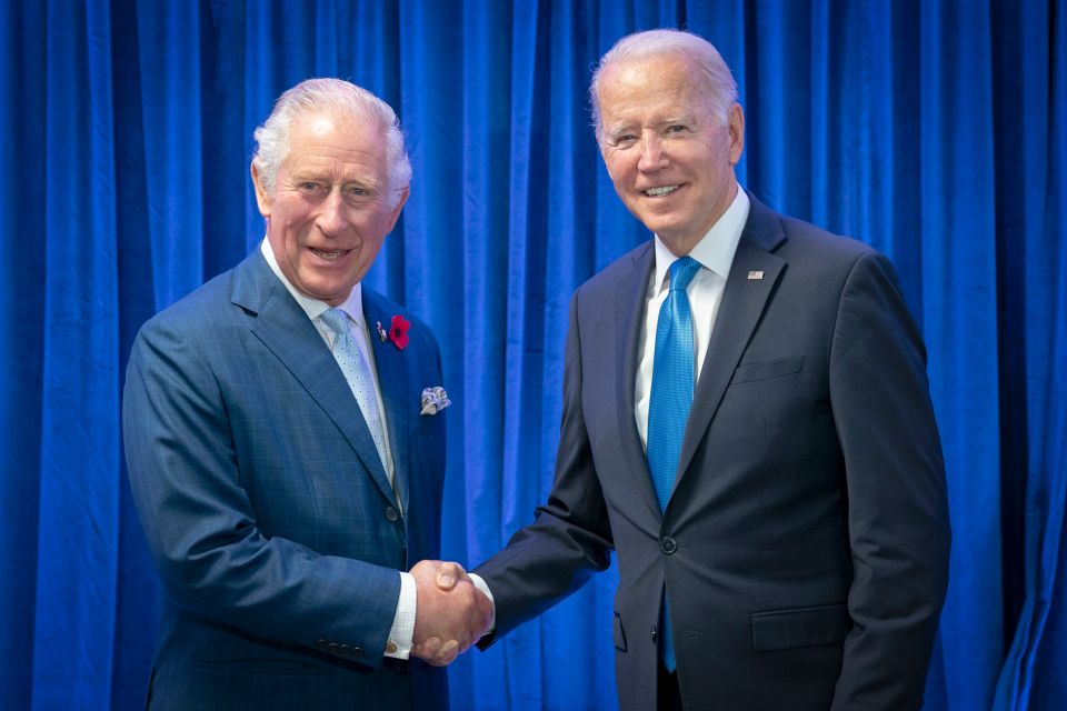 FILE - Britain's Prince Charles, left, greets President of the United States Joe Biden ahead of their bilateral meeting during the Cop26 summit at the Scottish Event Campus (SEC) in Glasgow, Scotland, Tuesday, Nov. 2, 2021. Biden will head to Europe next week for a three-country swing in an effort to bolster the international coalition against Russian aggression as the war in Ukraine continues well into its second year. The U.S. president will begin his trip to the continent in London, where he will meet with King Charles III.  (Jane Barlow/Pool Photo via AP, File)