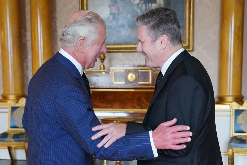 Britain's King Charles III (L) shakes hands and speak with Britain's Labour party leader Keir Starmer, during an audience, at Buckingham Palace, in London, on September 10, 2022. - King Charles III pledged to follow his mother's example of "lifelong service" in his inaugural address to Britain and the Commonwealth on Friday, after ascending to the throne following the death of Queen Elizabeth II on September 8. (Photo by Jonathan Brady / POOL / AFP) (Photo by JONATHAN BRADY/POOL/AFP via Getty Images)