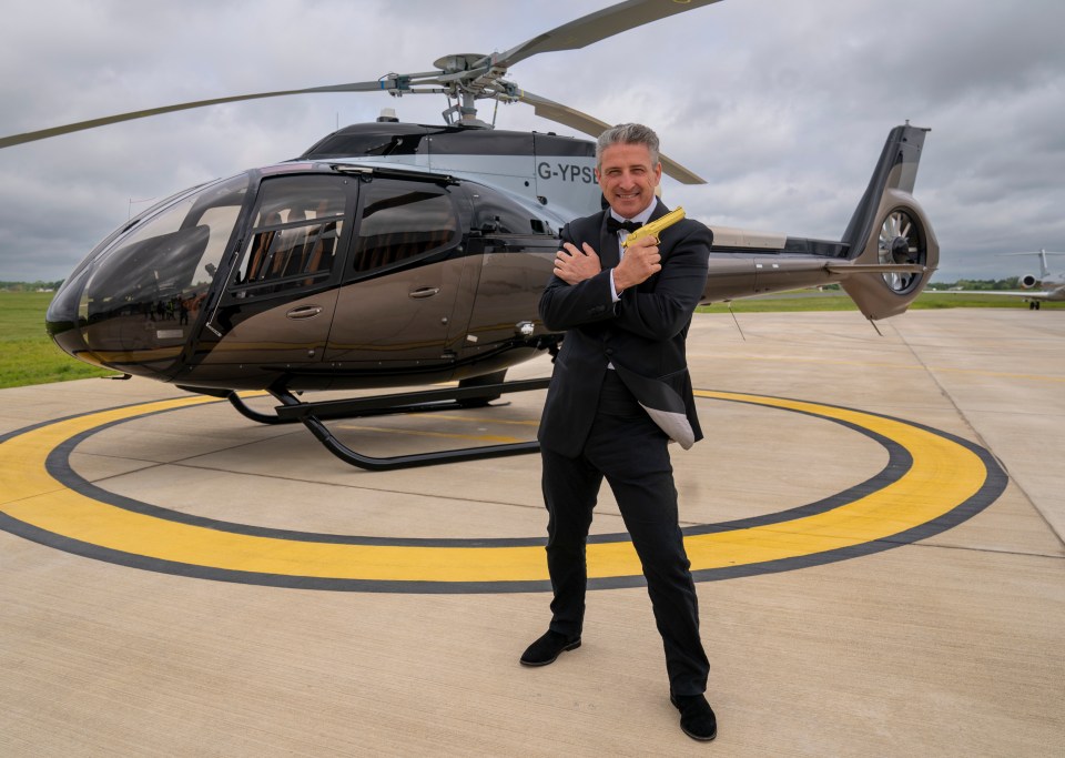 Alfie with his £4.5million Airbus helicopter styled by Aston Martin